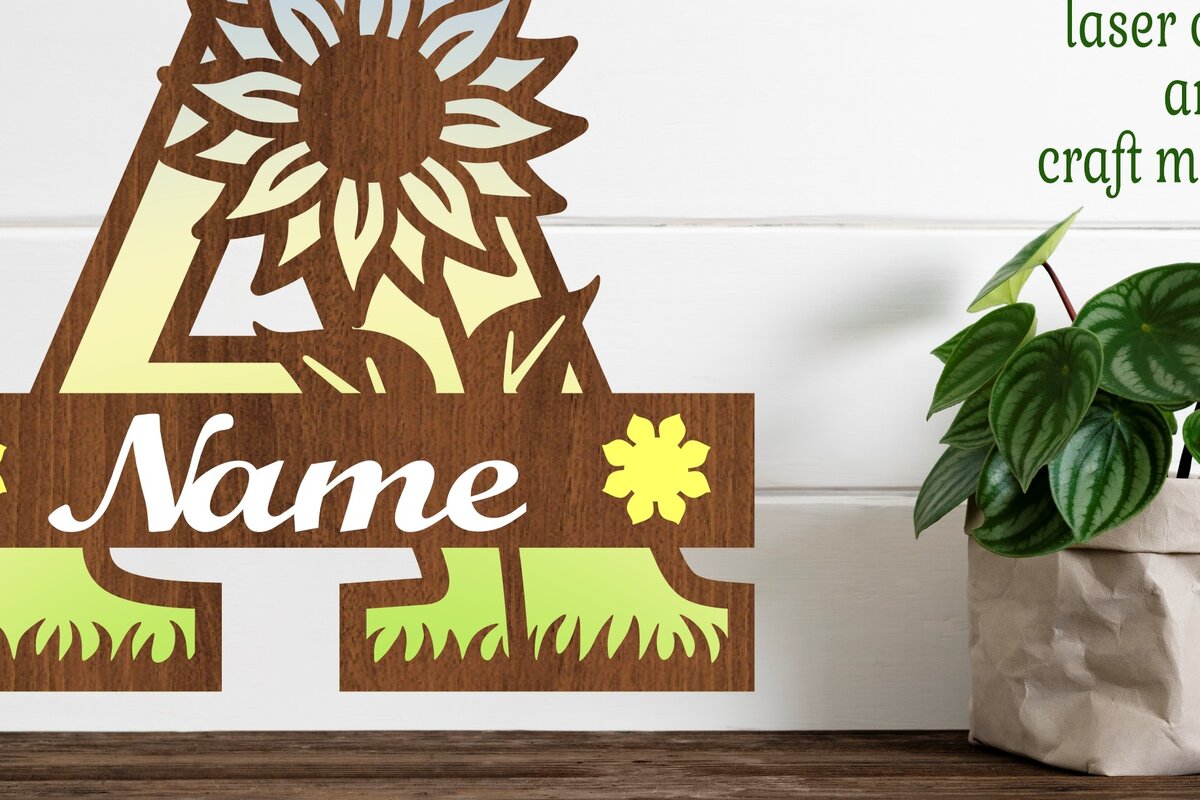 Σετ των 2 Intra απο ξύλο plywood 3mm-4mm πάχος – Μονόγραμμα ηλίανθου με κεφαλαίο γράμμα Δίασταση  20x20 cm INTRAFABR-75964998