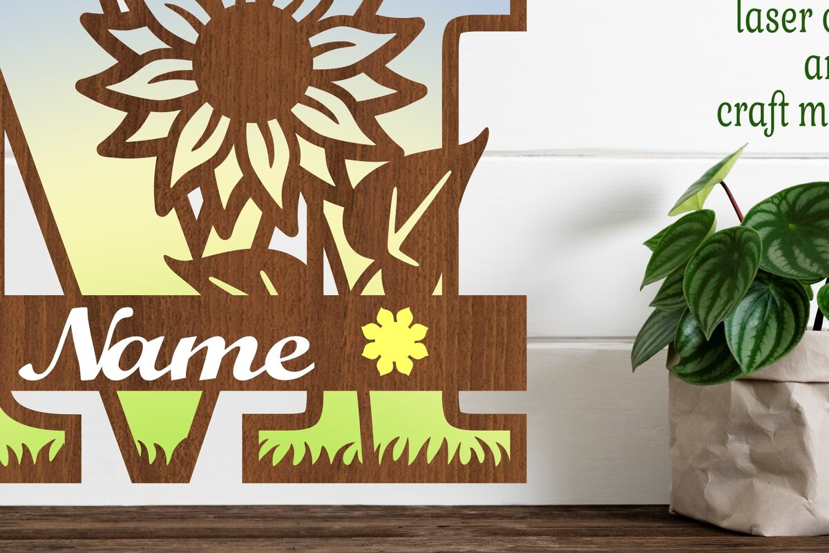 Σετ των 2 Intra απο ξύλο plywood 3mm-4mm πάχος – Μονόγραμμα ηλίανθου κεφαλαίο γράμμα M Δίασταση  20x20 cm INTRAFABR-75965323