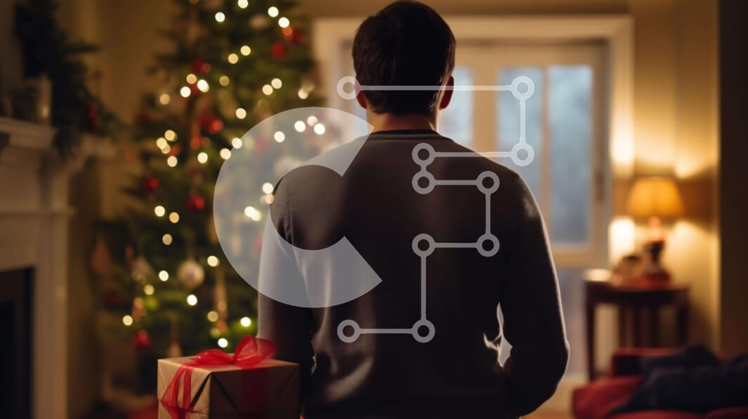 Intra Συλλεκτικό Ξύλινο Παζλ Plywood  4mm - Άνδρας που στέκεται μπροστά από το χριστουγεννιάτικο δέντρο κρατώντας ένα ξετυλιγμένο δώρο Σε Ξύλινο Κουτί - Διαστάσεις: 10x10 cm – 25 κομμάτια