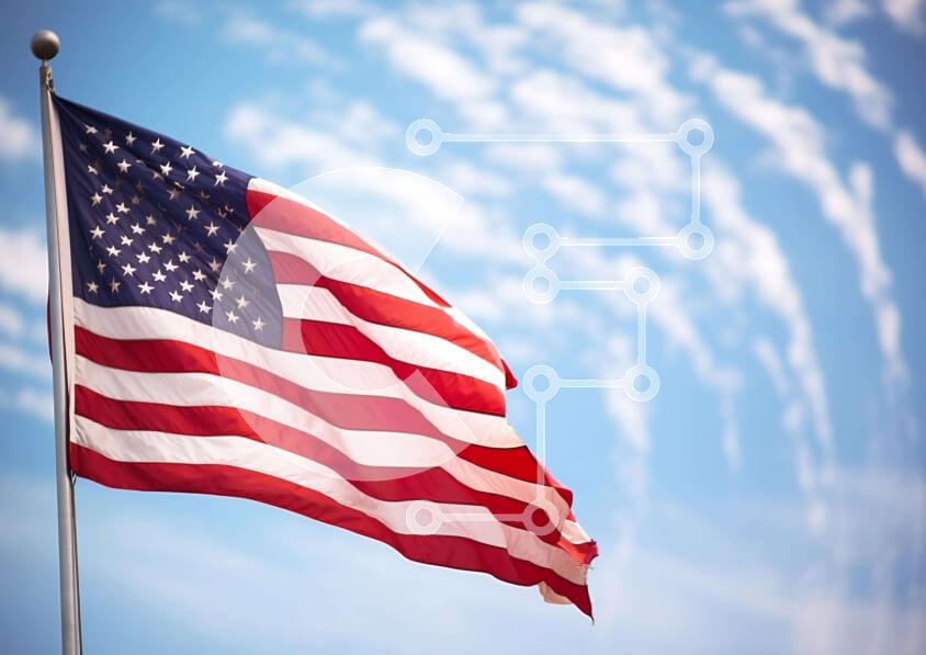 Intra Συλλεκτικό Ξύλινο Παζλ Plywood  4mm - Αμερικανική σημαία που κυματίζει ενάντια στο συννεφιασμένο μπλε ουρανό Σε Ξύλινο Κουτί - Διαστάσεις Puzzle: 10x10 cm – 25 κομμάτια