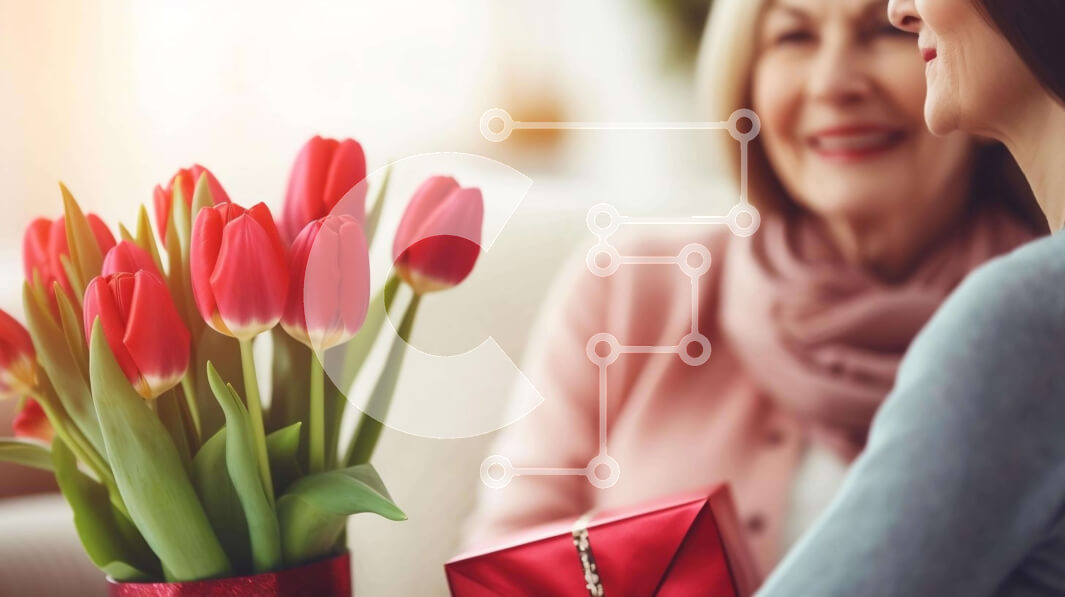 Intra Συλλεκτικό Ξύλινο Παζλ Plywood  4mm - Δύο γυναίκες που κάθονται μαζί με τις κόκκινες τουλίπες στο φόντο Σε Ξύλινο Κουτί - Διαστάσεις Puzzle: 10x10 cm – 25 κομμάτια