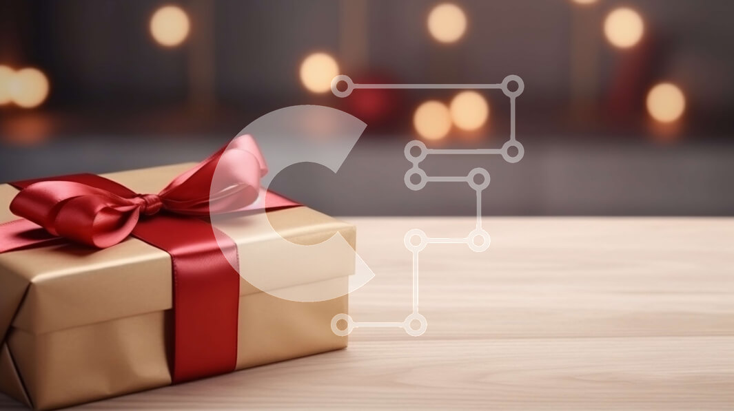 Intra Συλλεκτικό Ξύλινο Παζλ Plywood  4mm - Κουτί δώρου με κόκκινη κορδέλα σε ξύλινο τραπέζι με χριστουγεννιάτικο δέντρο σε φόντο Σε Ξύλινο Κουτί - Διαστάσεις: 10x10 cm – 25 κομμάτια